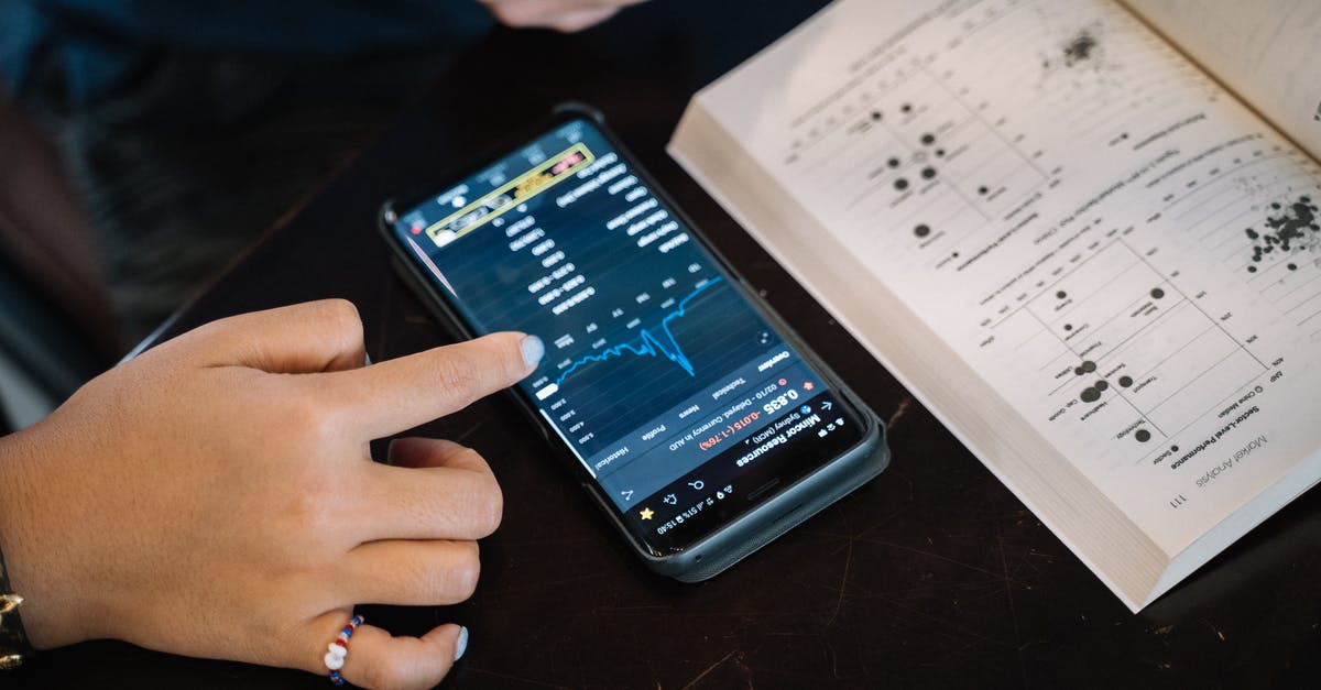 E-Ticket vs Itinerary vs Booking Reference - Person Studying And Making A Research On Smartphone