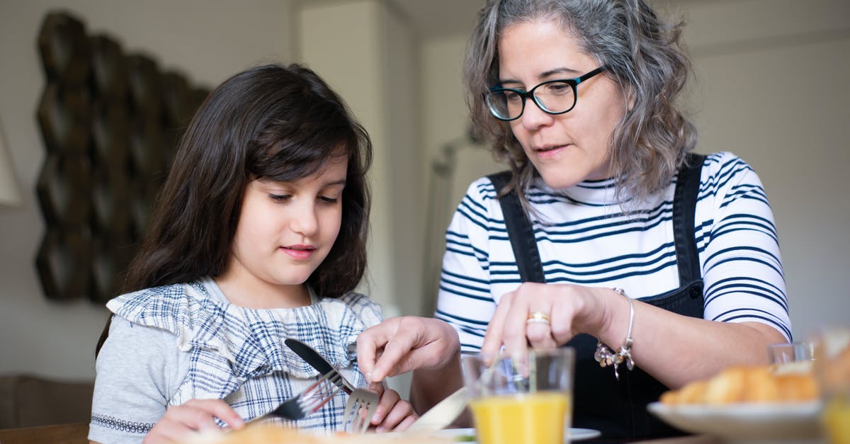 Etiquette for visiting a Hong Kong family in mourning - Elderly Woman teaching her Granddaughter Table Manners