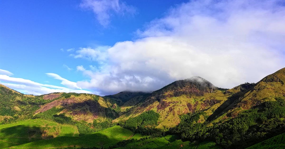 EU Blue card applied and travel back to India - Green Mountain Under Cloudy Sky