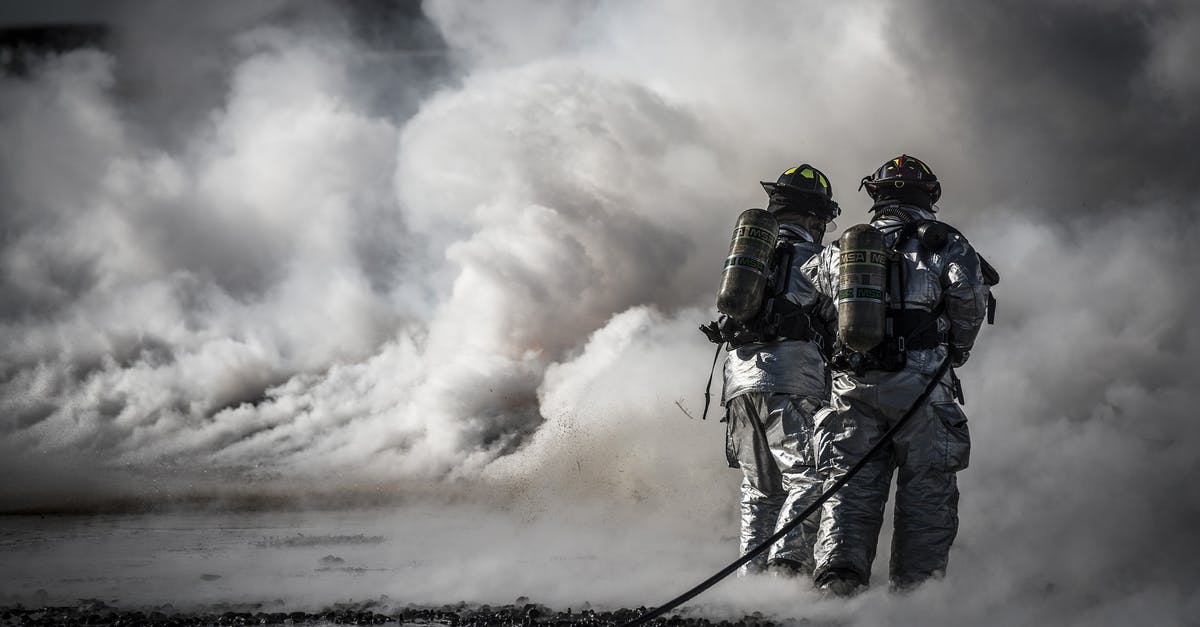 EU compensation - fire alarm at the Flight Crew's hotel - Firefighter Standing Beside Smoke