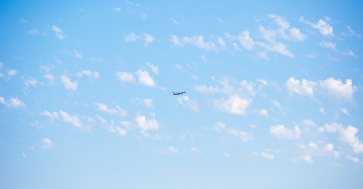 EU flight compensation distance for connecting flight - Photo of Airplane Flying Through the Sky