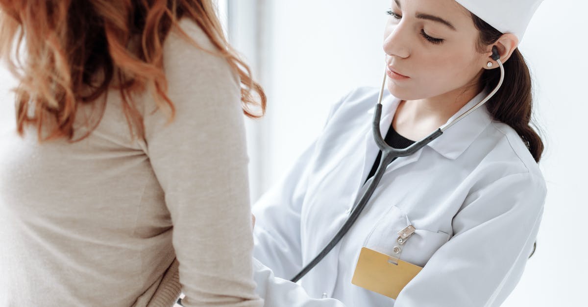 EU: Medical insurance mandatory at border control? - Photo Of Doctor Checking On Her Patient