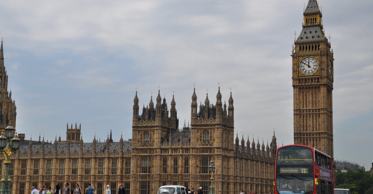 EU resident traveling to UK with French spouse - People and Vehicles Traveling on the Road near the Famous Palace of Westminster