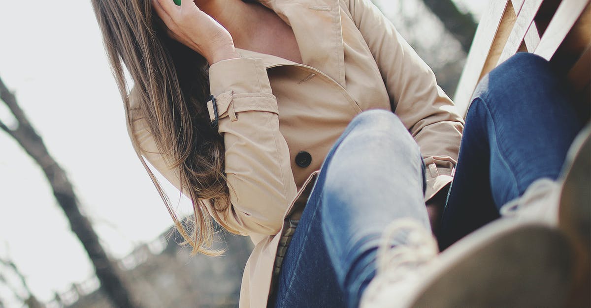 EU roaming when calling a number outside the EU? - Woman Holding Smartphone While Sitting on Bench