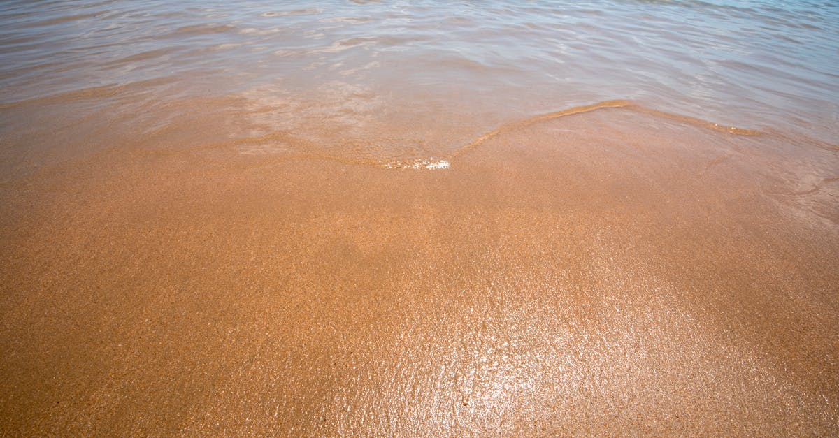 EU Travel at the end-of-year [closed] - beach water ocean blue,background,yellow sand and blue water