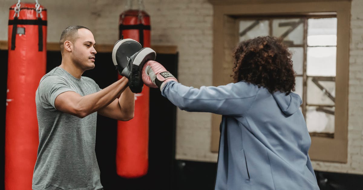 Eurostar train to Paris during a strike - Ethnic trainer working out with unrecognizable boxer in gym