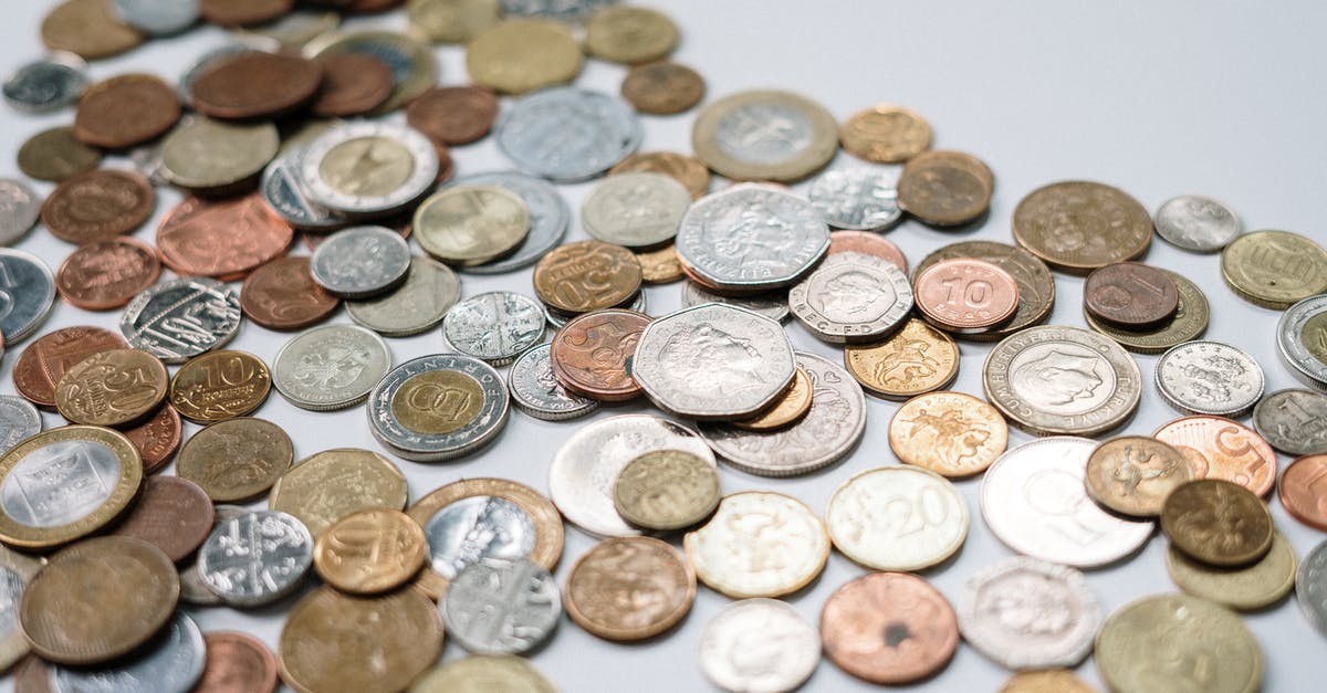 Exchanging Dollars for Yuan - Gold and Silver Round Coins