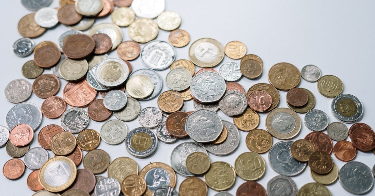 Exchanging Dollars for Yuan - Gold and Silver Round Coins