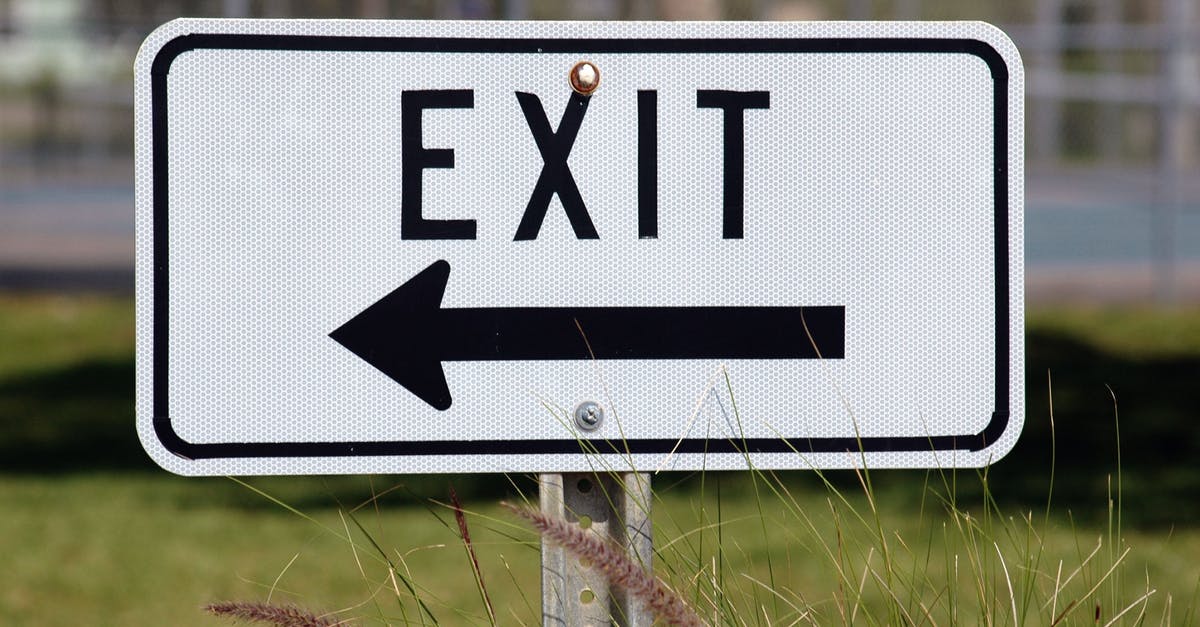 Exiting Canada with another passport and exit information - Exit Signage Pointing at Right Side