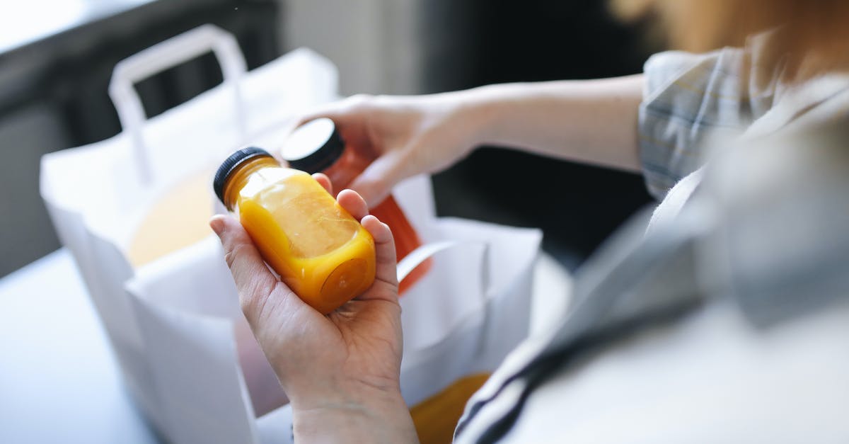 Expanding items? - Person Holding Orange Plastic Bottle