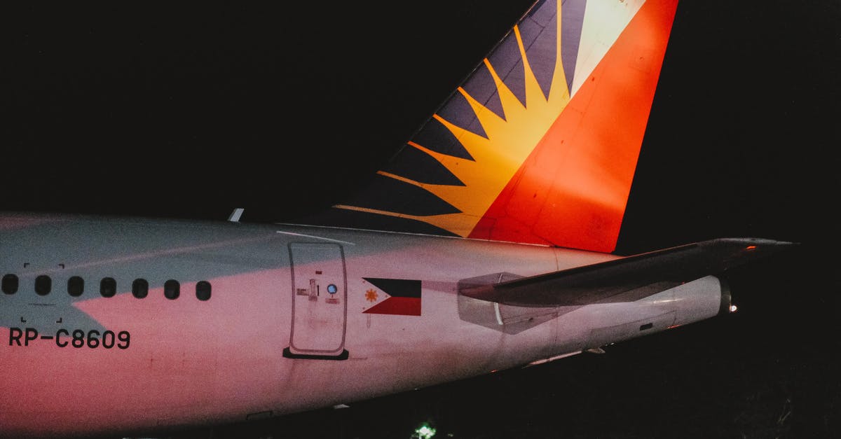 Expedited exit clearance certificate in the Philippines - White and Orange Airplane in the Sky