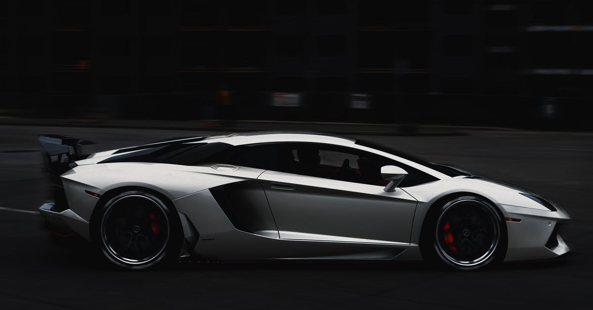 Expensive travel insurance due to my medical history [closed] - Grayscale Photo of a Lamborghini Aventador Car on the Road