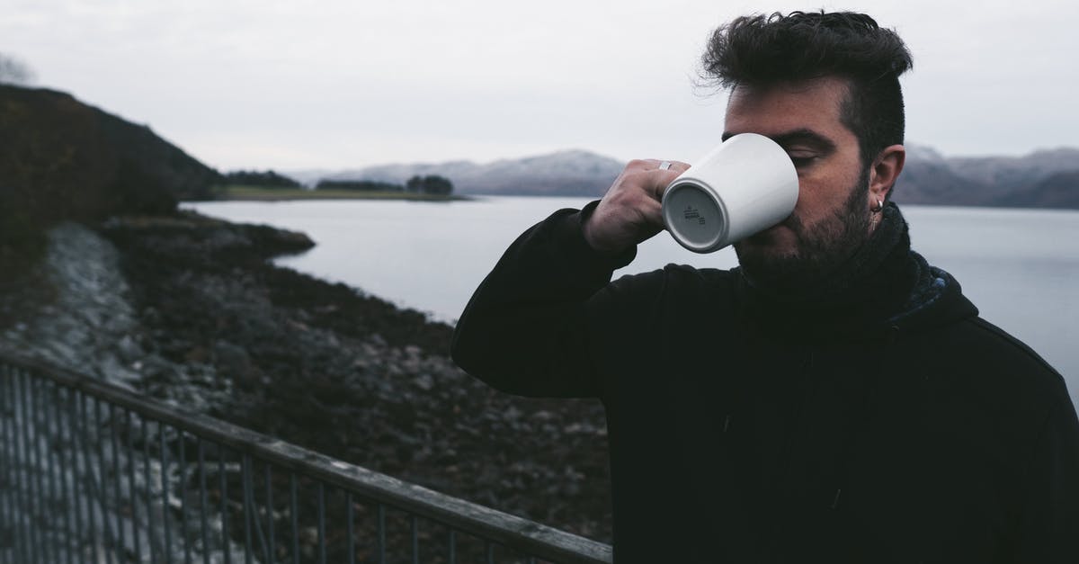 Experiencing Scotland in the Winters [closed] - Man Drinking on the Ceramic Mug