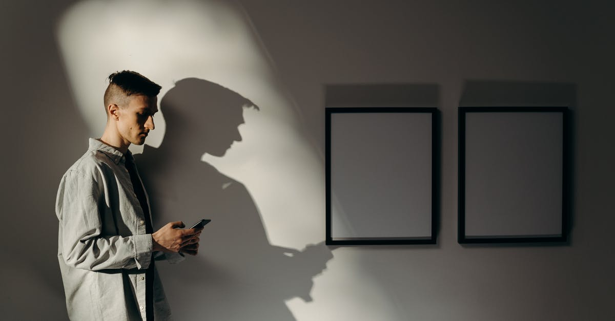 Extending visitor stay in the US - Man in White Dress Shirt Standing Near Wall