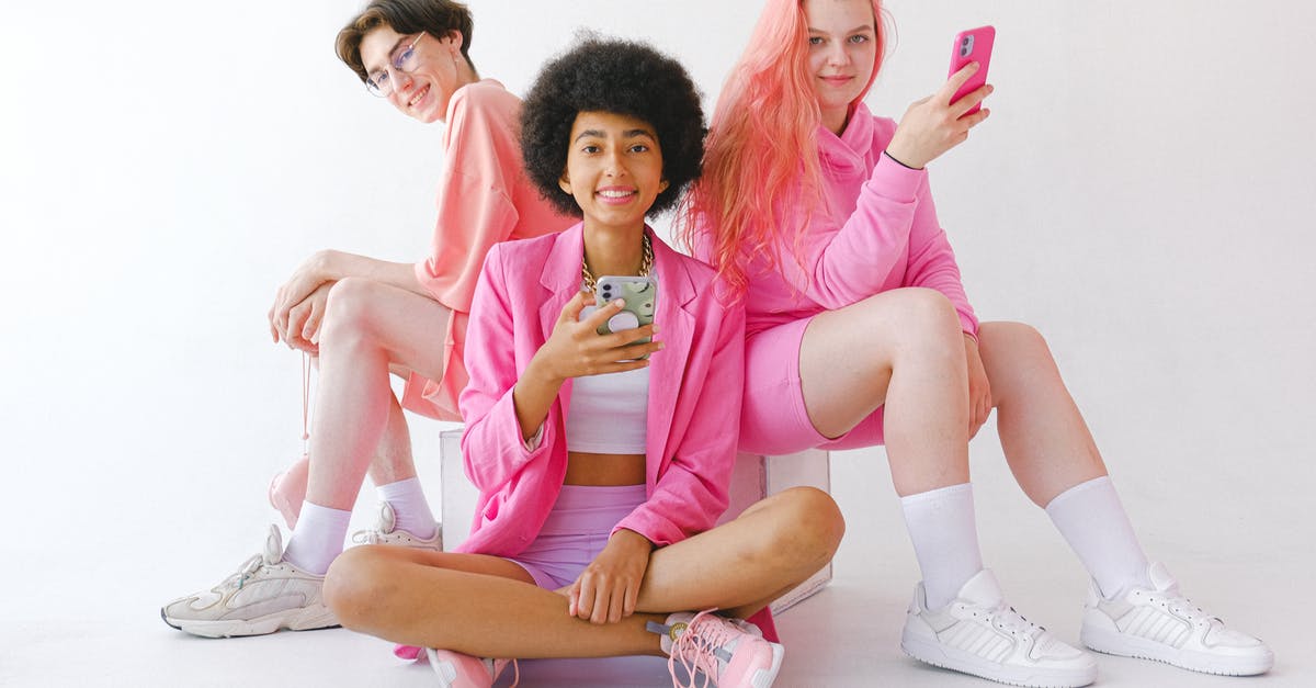 Extraordinary circumstances, missed connections and overnight stays - Cheerful multiracial teenagers in trendy outfit with smartphones