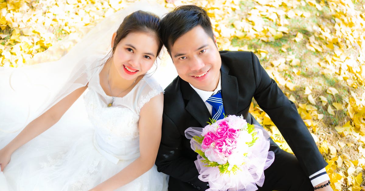 Fall events in Madrid - Portrait of a Smiling Bride and Groom in a Park at Fall 