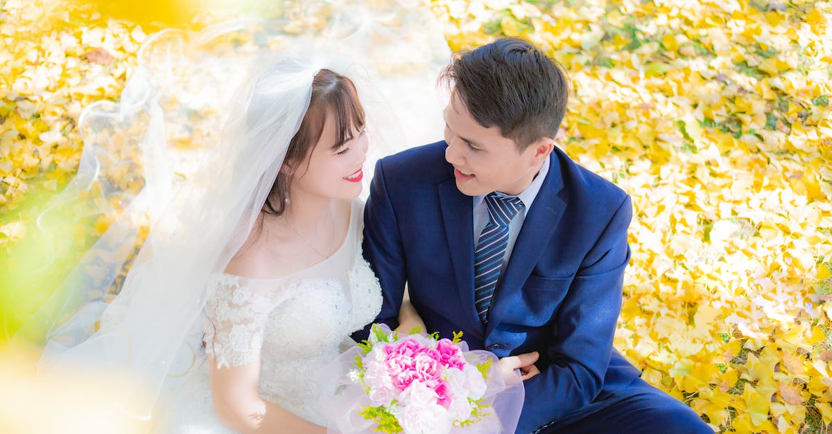 Fall events in Madrid - Married Couple Sitting in a Park at Fall