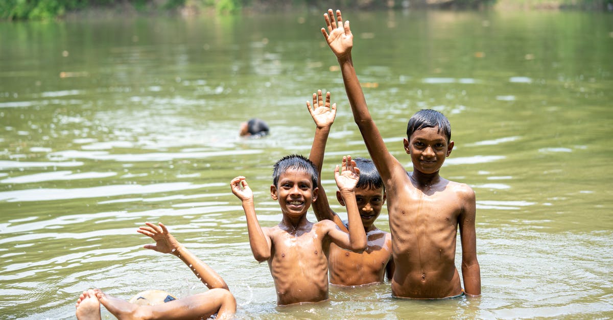 Family travel in Thailand - is it safe, can we improvise? - playing in the water with one spilled child