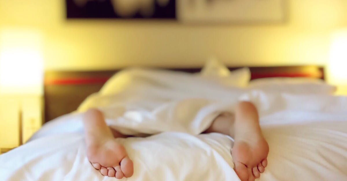 Family visit and sickness - Person Lying on Bed Covering White Blanket