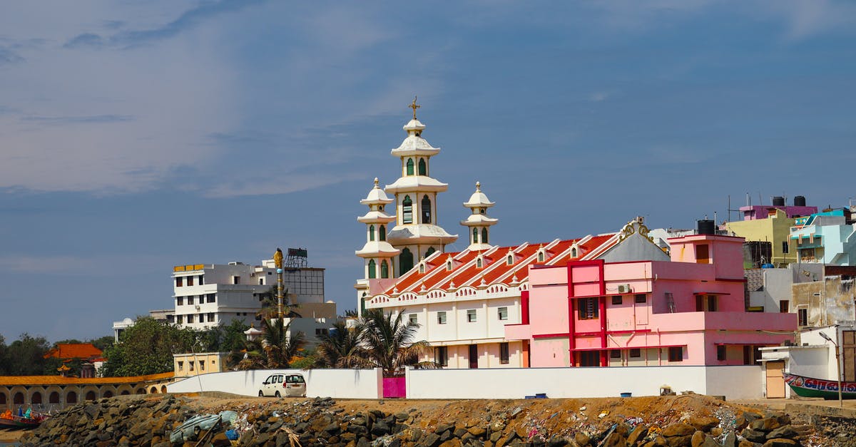 Fares and timings for boating in Kanyakumari - White and Red Concrete Building Near Body of Water