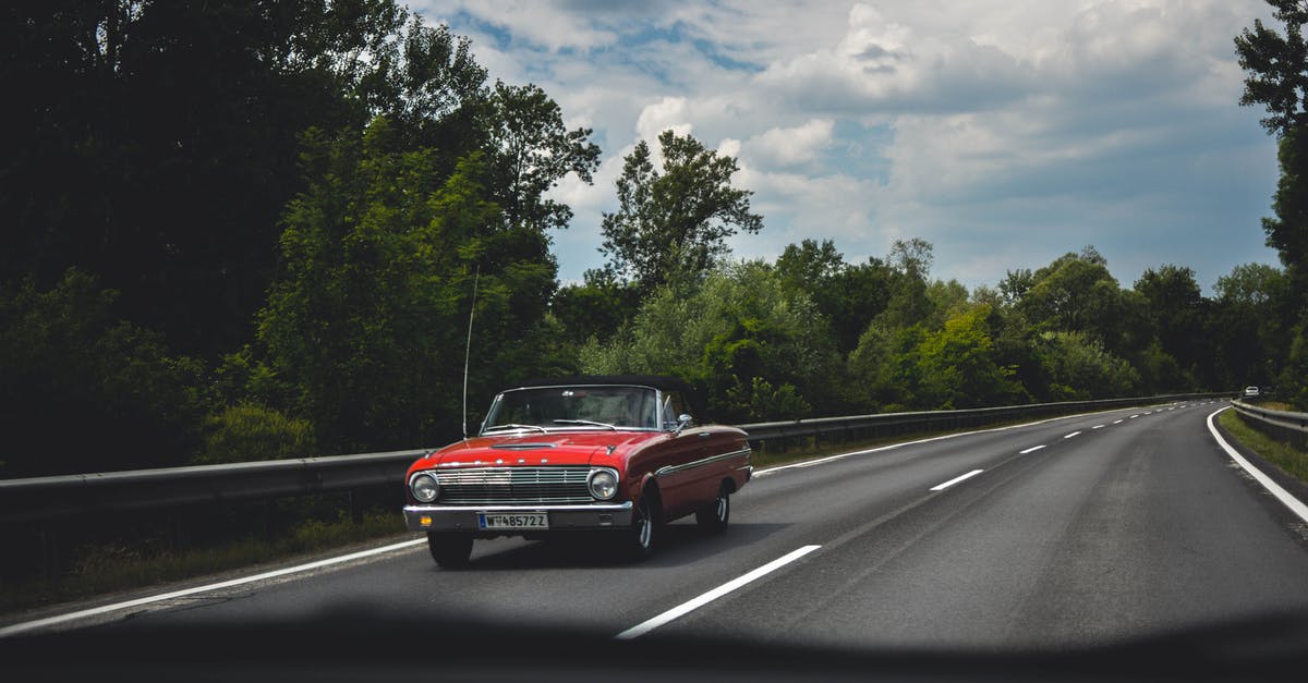 Fast lane in the UK? [duplicate] - Photography of Red Car on Road