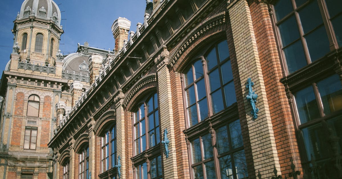 Fastest public transport from Vienna airport into city center? - Low angle of famous historical building of Nyugati railway station located in Budapest Hungary on sunny day