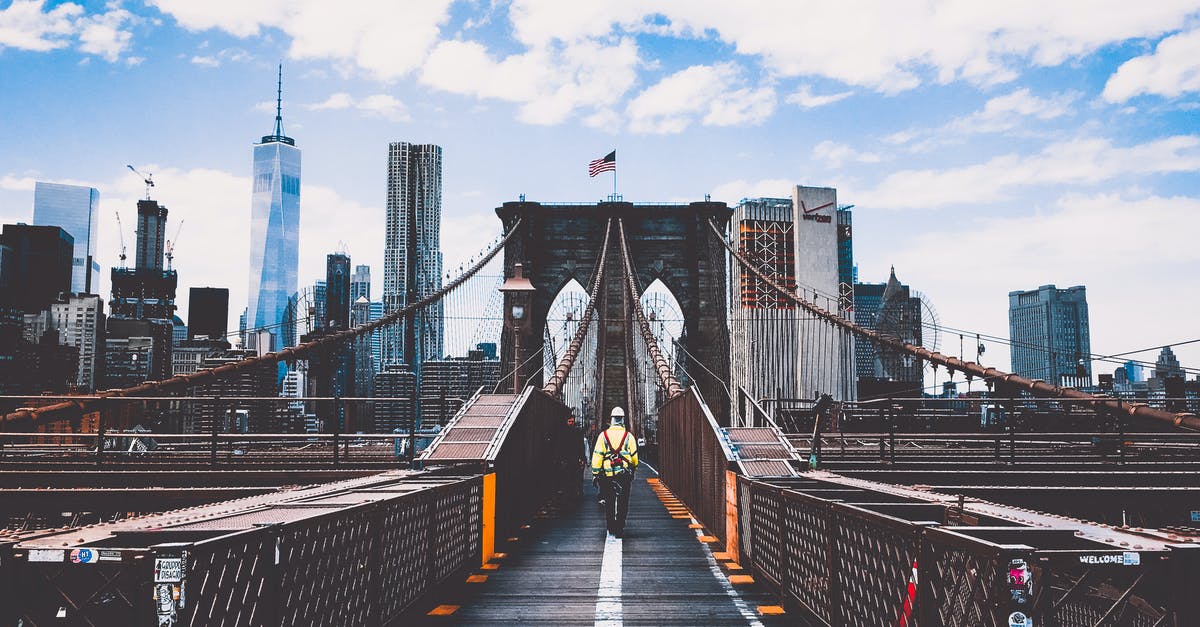 Fastest/cheapest New York airport to get to Brooklyn - Man Walking on Bridge