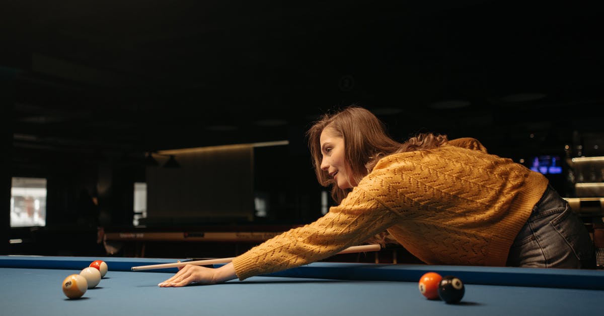 Fee-free ATMs in Singapore? - Woman in Brown Sweater Playing Billiard