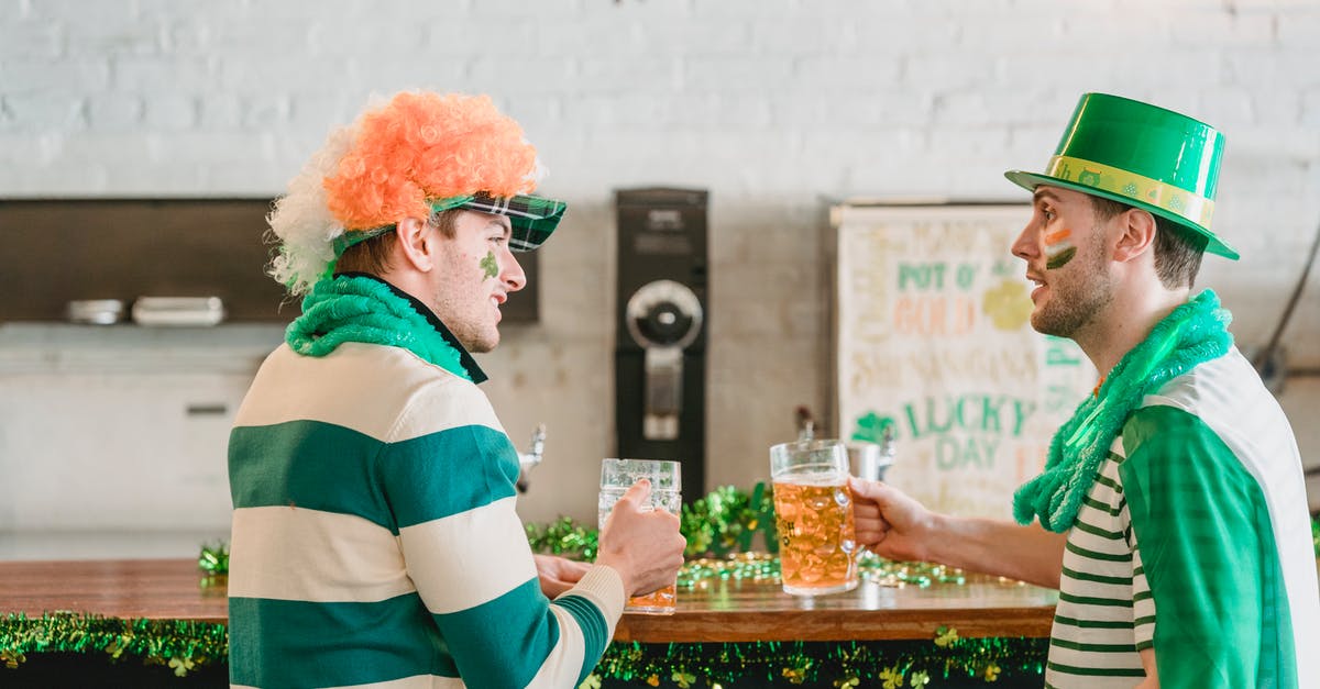 Filipino national getting a visa via a British partner - Friends with beer talking during Feast of Saint Patrick