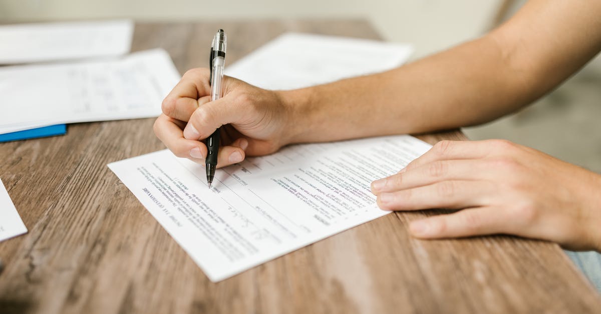 Filling up the VIDEX Form (Schengen Visa) Regarding Address - Close-Up Shot of a Person Filling Out a Form