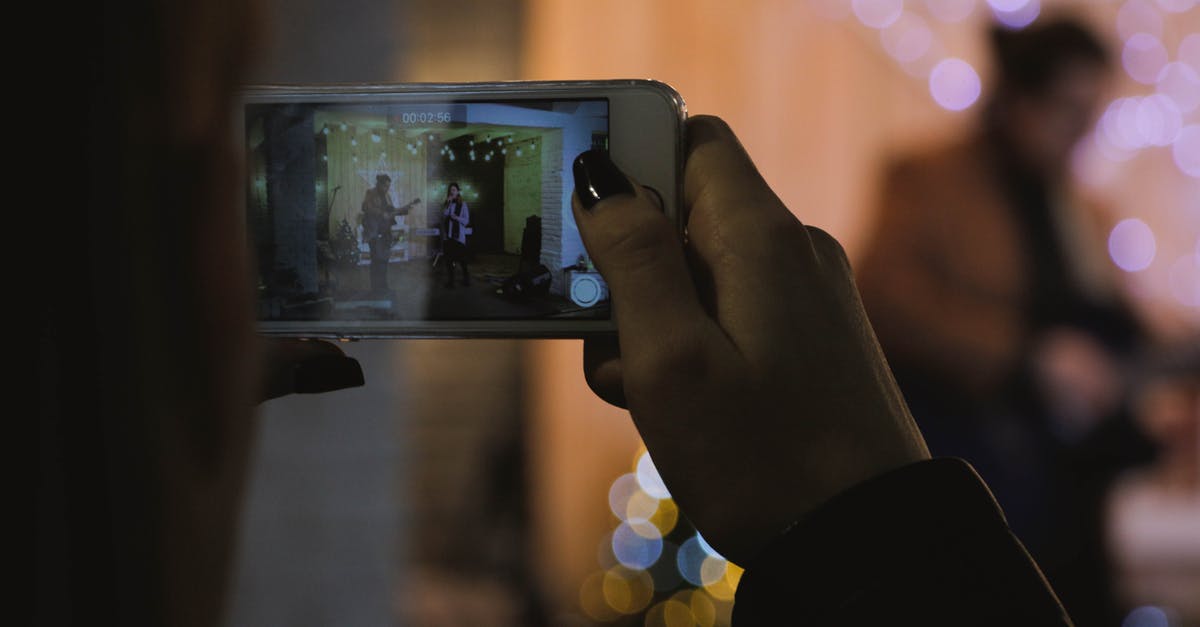 Filming via iPhone in clubs in Atlanta [closed] - Shallow Focus Photography of Person Holding Silver Iphone 6s