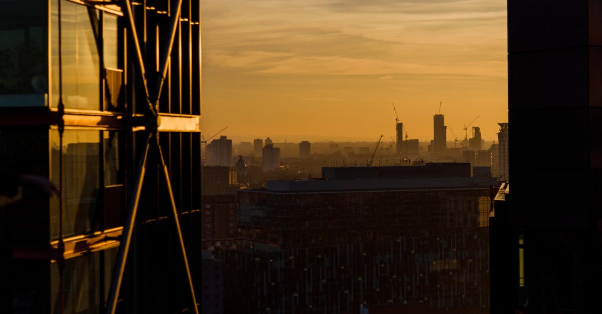 Financial evidence when entering UK - Sunset sky over megapolis with modern architecture