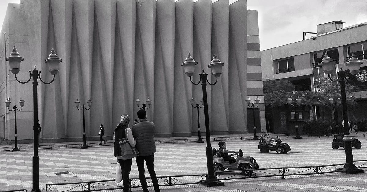 Finding a place to stay in Cancun (or anywhere really) as a single male - Grayscale Photo of Woman Walking on Sidewalk