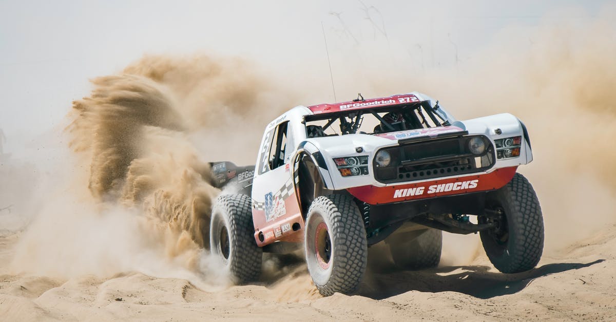 Finding big cacti between Phoenix, Las Vegas, and Los Angeles - Offroad Car Going Through Sandy Desert