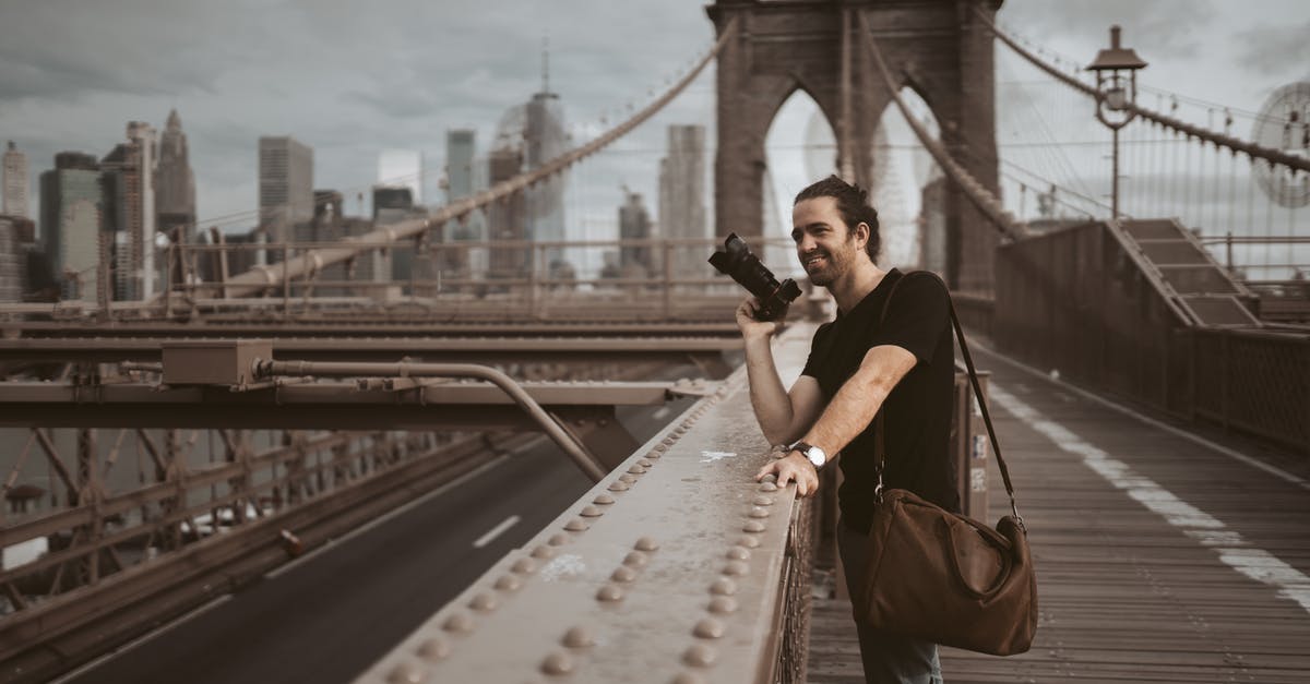 Finding connections list of US flights - Photo Of Man Holding Black Camera