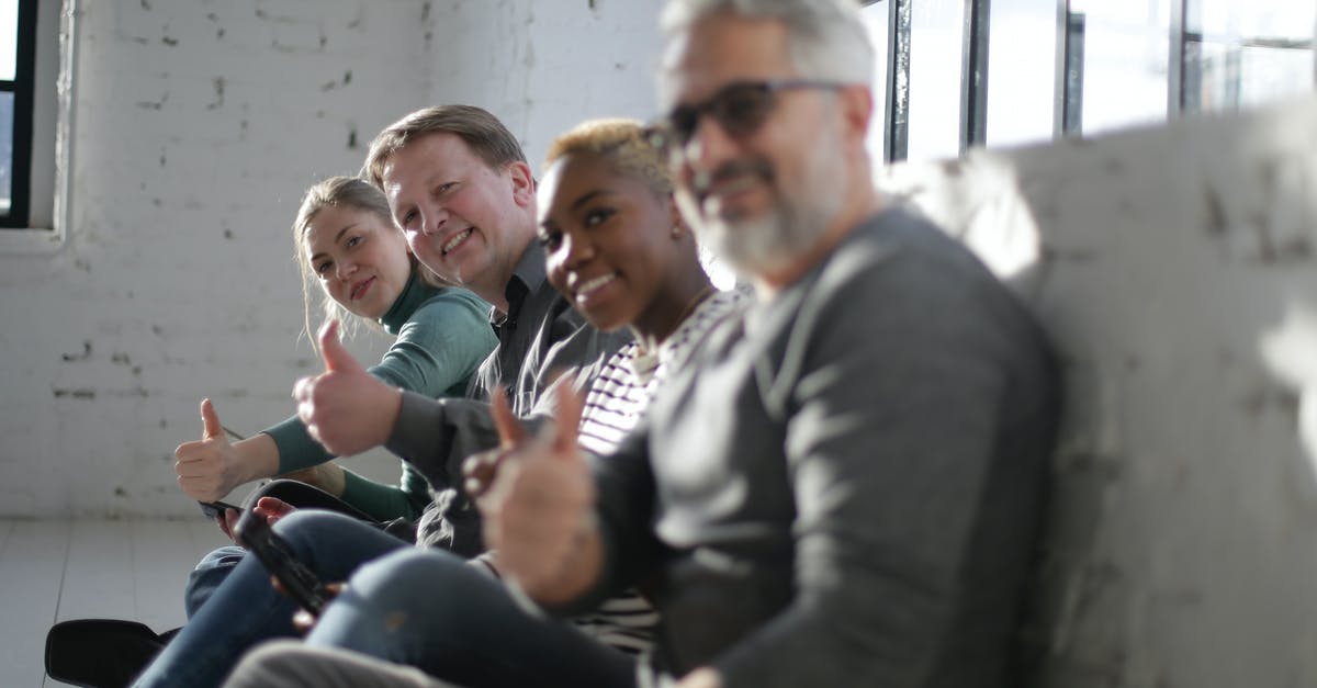 Finding good Escape Rooms in Budapest? - Cheerful diverse friends demonstrating thumb up gesture