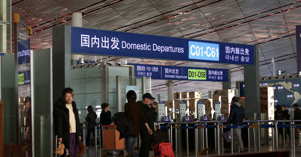 Finding local train ticket agents/offices in China. - People Walking on the Sidewalk