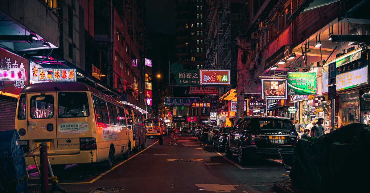 Finding the "Airport Express Shuttle Bus" at Hong Kong station? - Assorted-color Car Parked Beside Restaurant