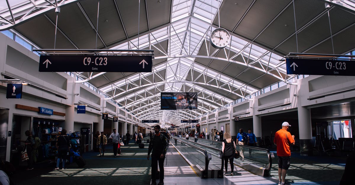 Finding the train station at Copenhagen airport - People Inside a Terminal Airport