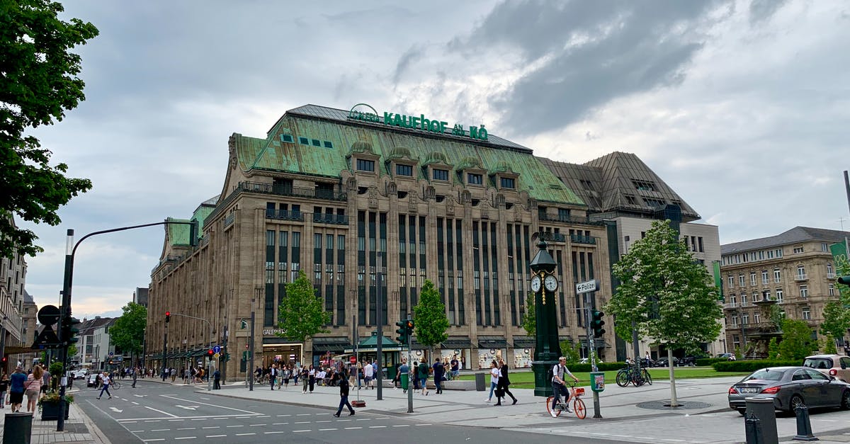 Finding travelers to Germany from Hungary by car - Old building facade located on city street