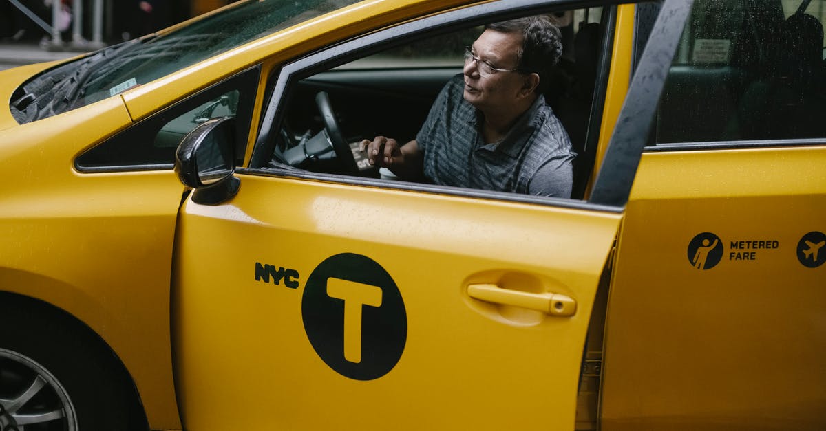 Fined for driving in NY with foreign drivers license - Taxi driver getting out of yellow cab