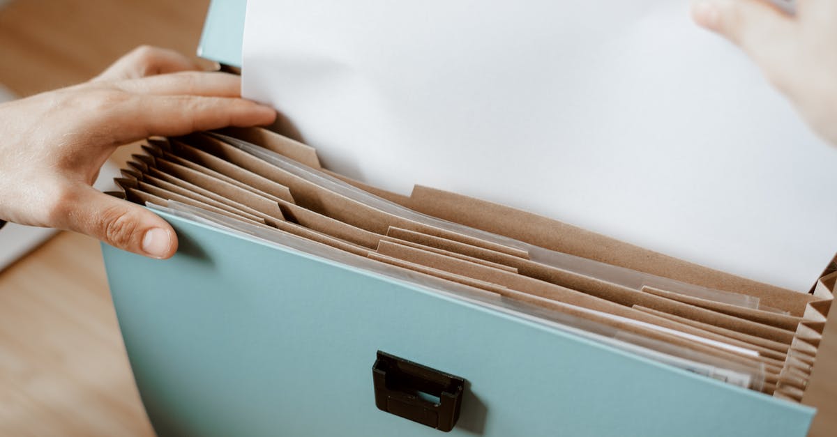 First name put as "Mr" in Airticket - Person taking white paper from folder