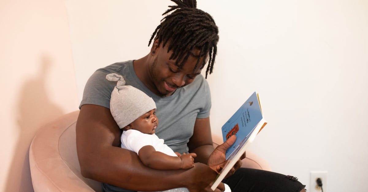 First time traveler: how do I book flights? - Photo Of Man Carrying Baby