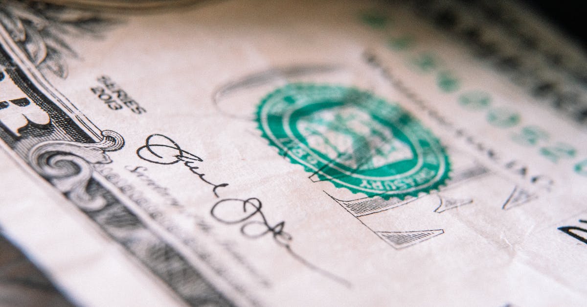 First-time US passport applicant from abroad [closed] - From above closeup one US dollar bill placed on table with front side up