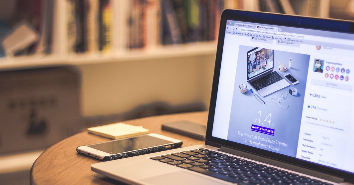 Flight booking web sites - Silver Laptop Computer Beside White Smartphone on Brown Wooden Table