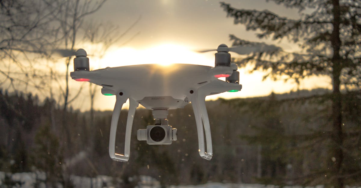 Flight delay compensation due to weather (EU) - Photo of White Drone Quadcopter Flying Near Trees at Noontime