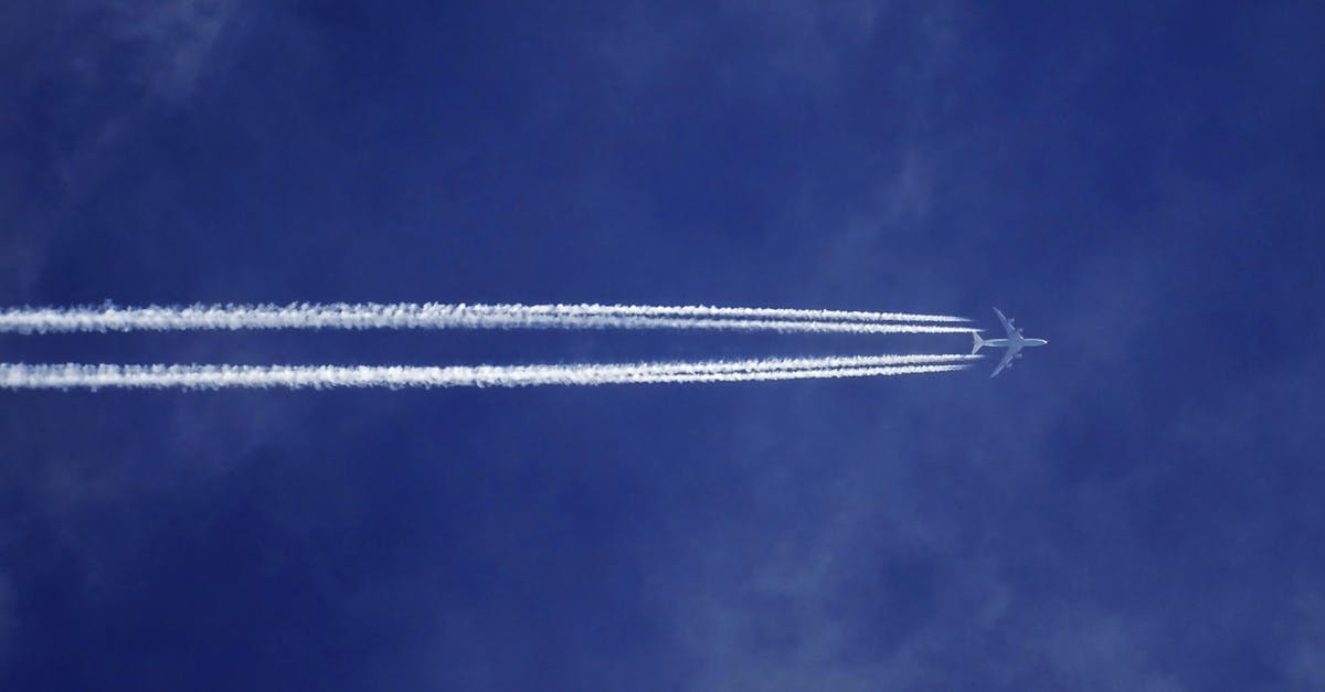 Flight delay compensation due to weather (EU) - Bottom View of Plane With Contrail