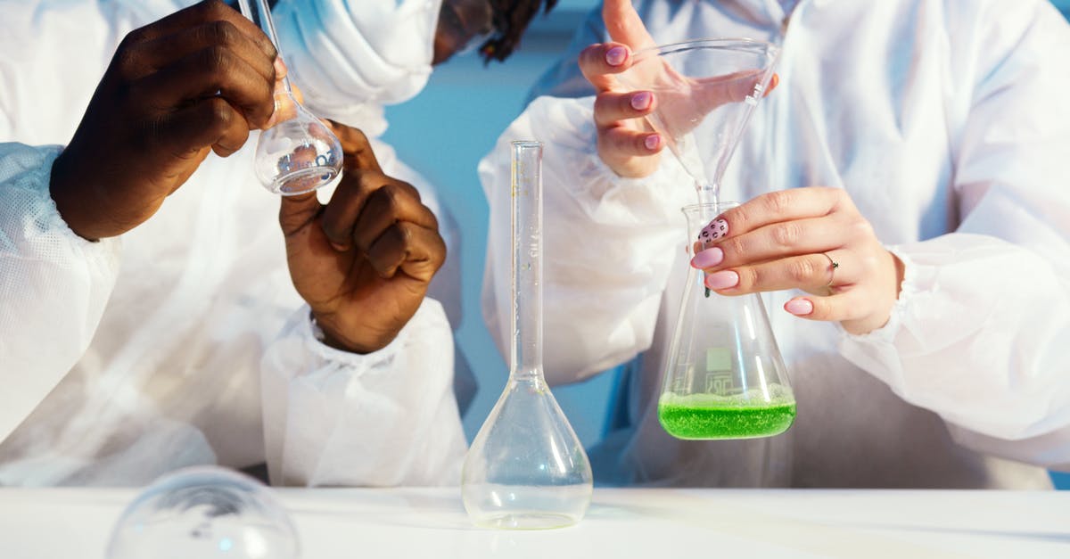 Flight safety and liquid chemicals: 95% alcohol and formol - A Man and a Woman Doing an Experiment