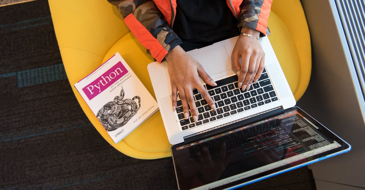 Flight/booking code explanation - Woman Programming on a Notebook