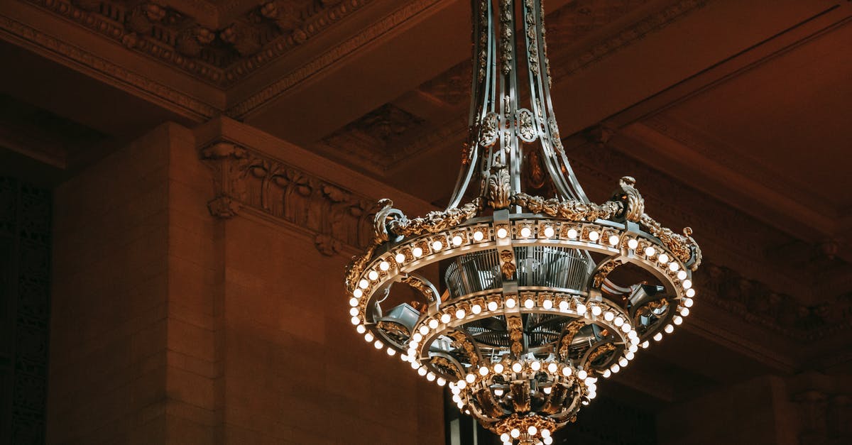 Florence Pass for museum, historical places and public transport? - From below of classic chandelier with bright shiny lamps in old public structure